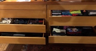 Tidy drawers with clothes neatly folded the KonMarie way.